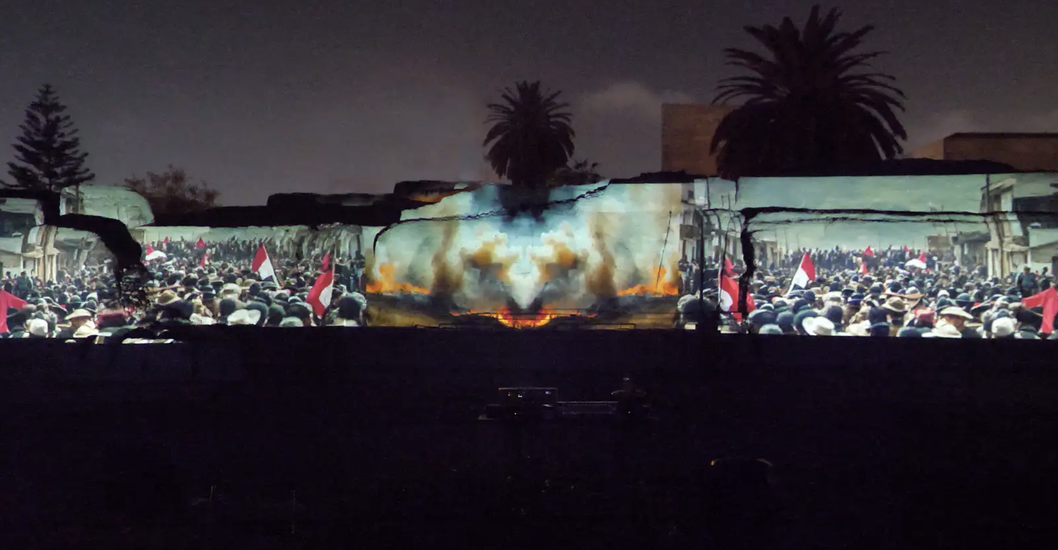 Video Projection Mapping Installation Video Projection displaying many people waving flags alongside images of fire and smoke