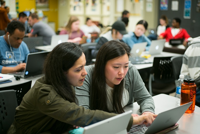 Two students conducting research
