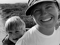 photo of Bonnie Dundee photo of Bonnie Dundee with child peeking behind her