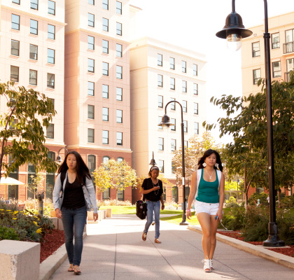 students walking outside of buildings